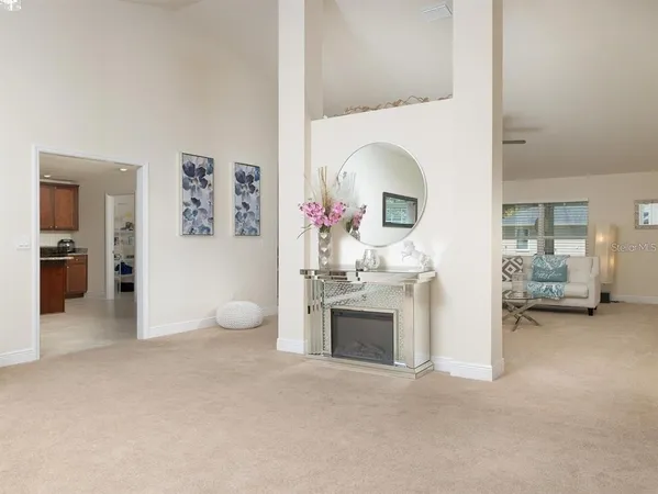 a view of a livingroom with furniture and a fireplace