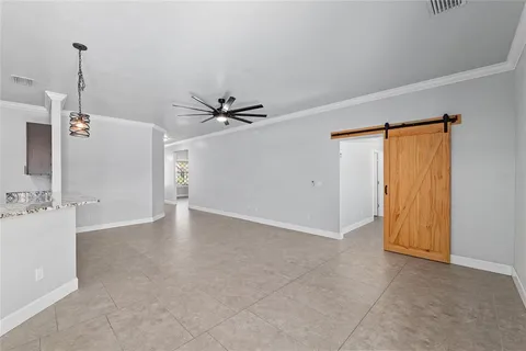 a view of kitchen with microwave and stove