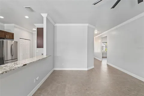 a bathroom with a granite countertop sink a large mirror and shower