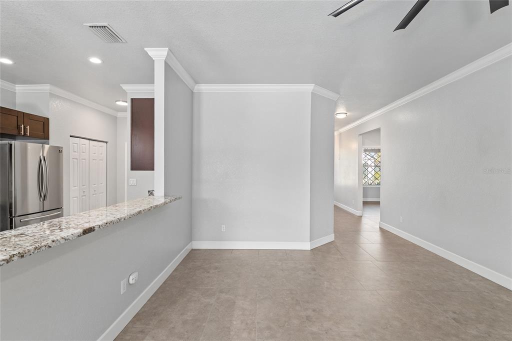 4765 Southeast 25th Street Ocala, FL 34480 - Photo 14 of 65 a view of an empty room with wooden floor