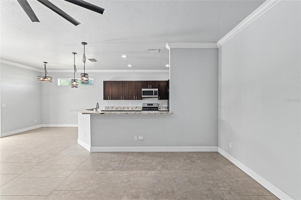 4765 Southeast 25th Street Ocala, FL 34480 - Photo 15 of 65 a view of kitchen with microwave and stove