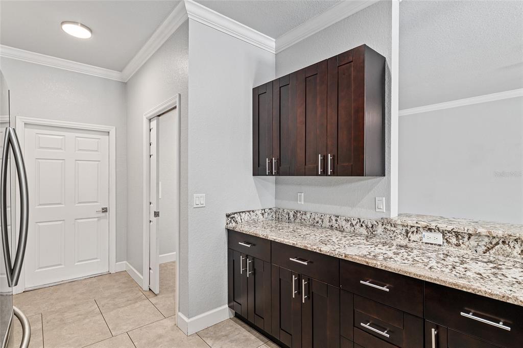 4765 Southeast 25th Street Ocala, FL 34480 - Photo 21 of 65 a bathroom with a granite countertop sink and a mirror