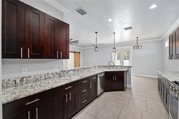 an empty room with closet and a ceiling fan