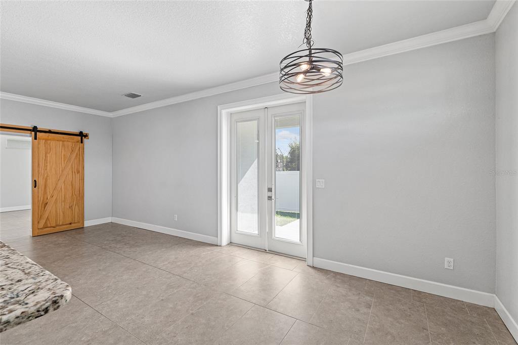 4765 Southeast 25th Street Ocala, FL 34480 - Photo 24 of 65 a view of an empty room with glass door