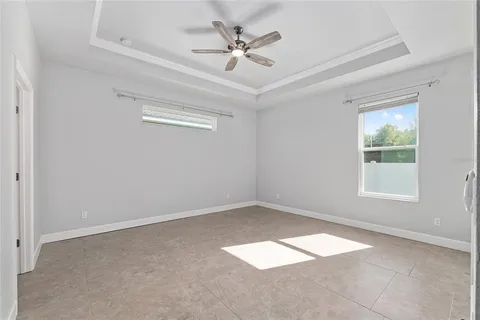 a view of a bathroom from the hallway with toilet