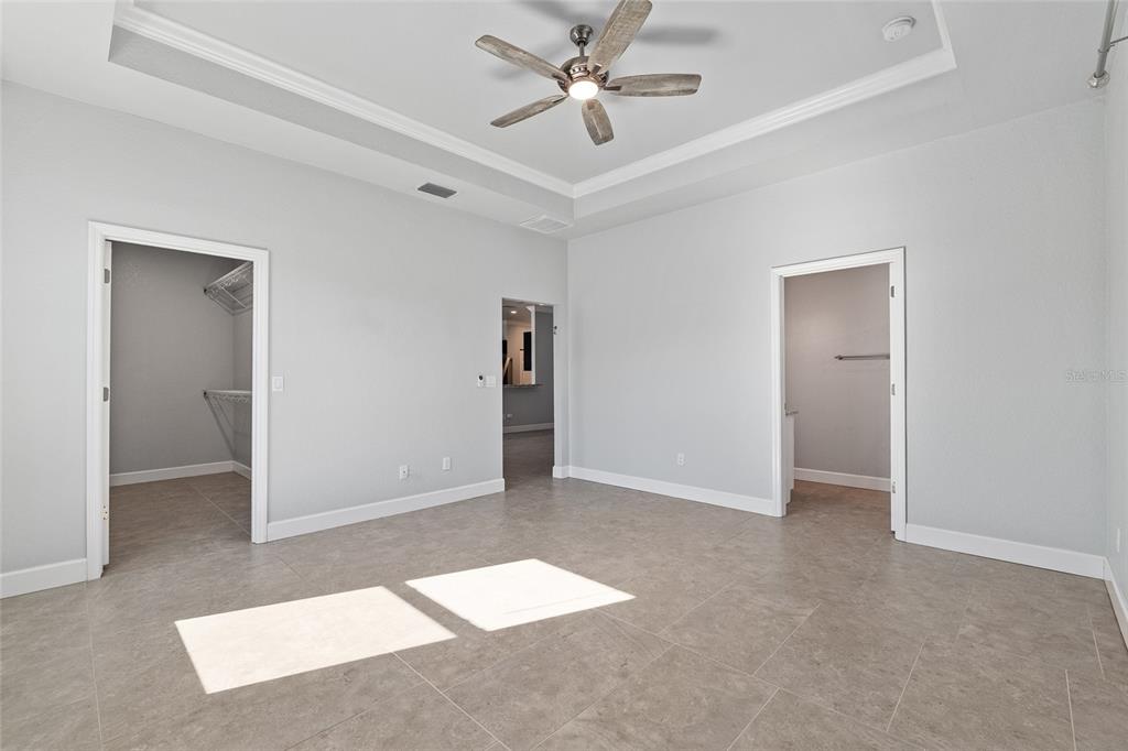 4765 Southeast 25th Street Ocala, FL 34480 - Photo 30 of 65 an empty room with closet and a ceiling fan