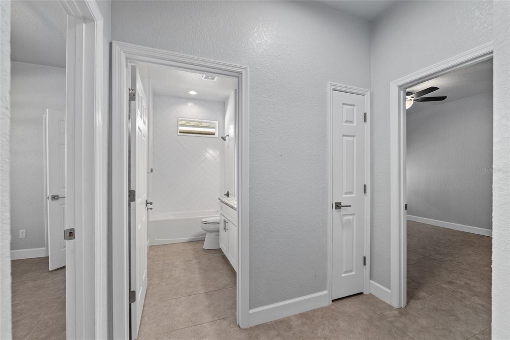 4765 Southeast 25th Street Ocala, FL 34480 - Photo 34 of 62 a view of a bathroom from the hallway with toilet