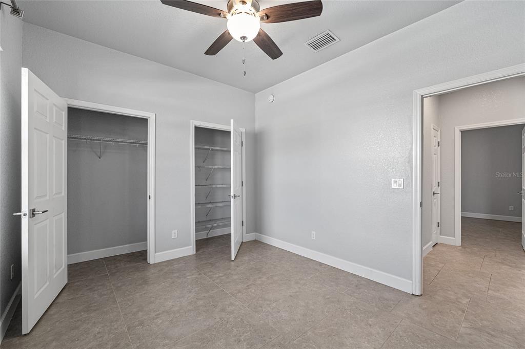 4765 Southeast 25th Street Ocala, FL 34480 - Photo 44 of 65 a view of an empty room with a ceiling fan