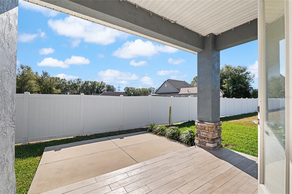 4765 Southeast 25th Street Ocala, FL 34480 - Photo 49 of 65 a backyard of a house with lots of green space and outdoor seating