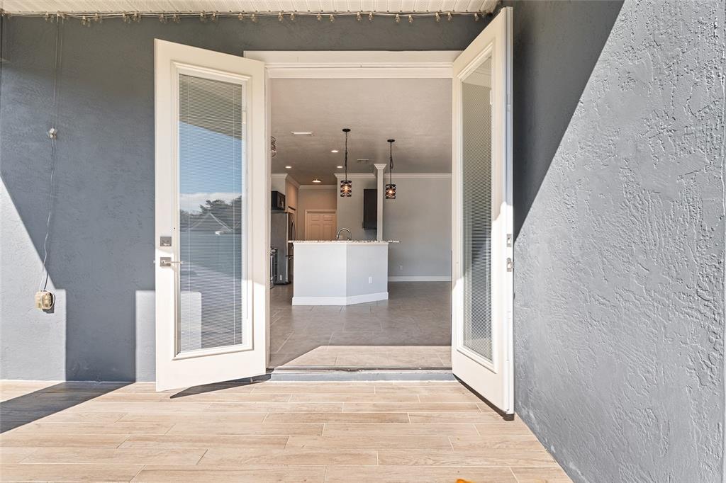4765 Southeast 25th Street Ocala, FL 34480 - Photo 50 of 65 a view of a hallway with wooden floor and a living room