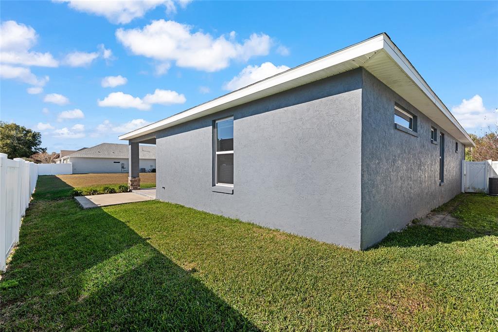4765 Southeast 25th Street Ocala, FL 34480 - Photo 52 of 62 a backyard of a house with lots of green space