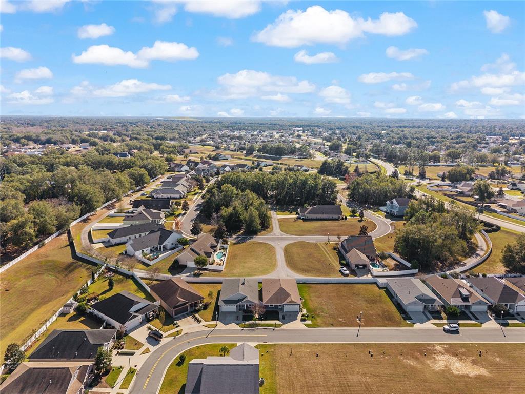 4765 Southeast 25th Street Ocala, FL 34480 - Photo 54 of 62 an aerial view of a house with a swimming pool