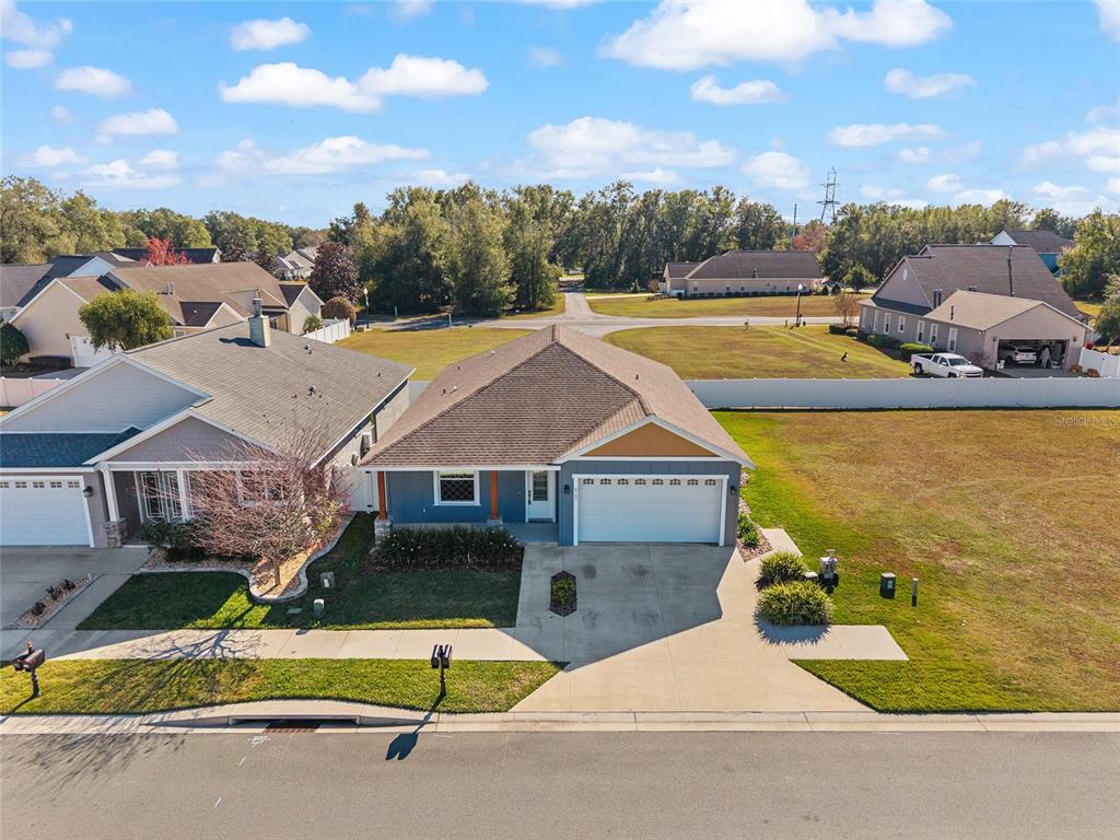 4765 Southeast 25th Street Ocala, FL 34480 - Photo 59 of 65 an aerial view of a house with a swimming pool and mountains