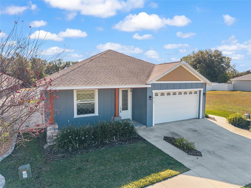 4765 Southeast 25th Street Ocala, FL 34480 - Photo 61 of 65 a view of a house with a yard