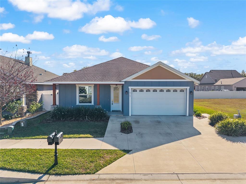4765 Southeast 25th Street Ocala, FL 34480 - Photo 62 of 65 a front view of a house with garden