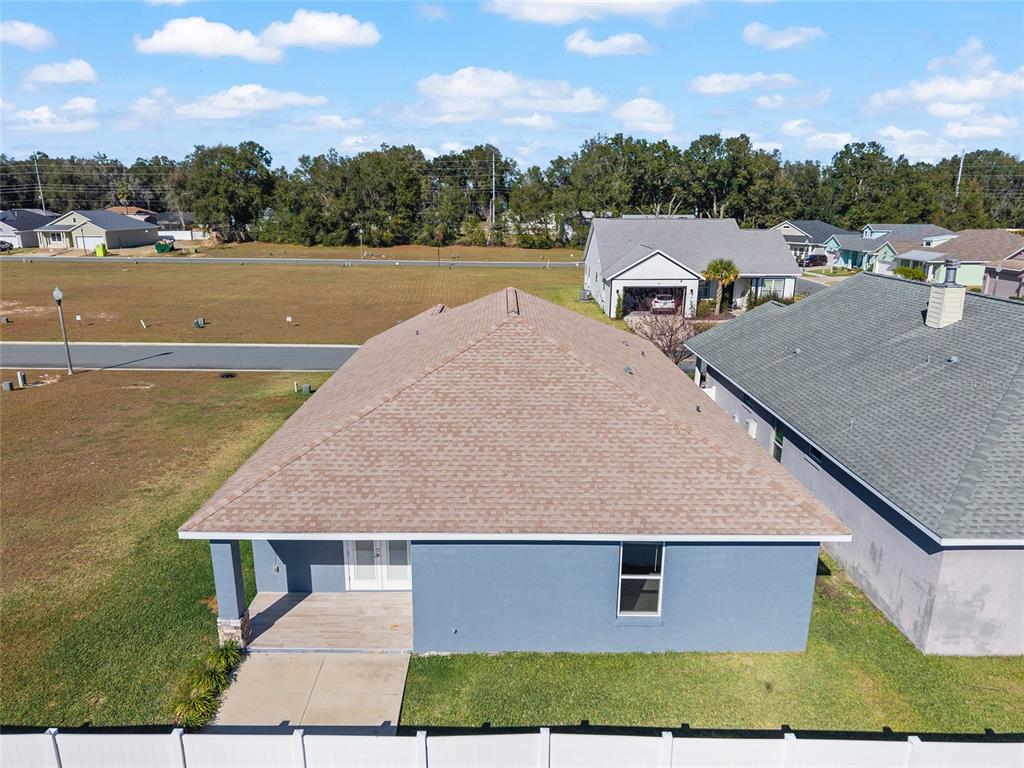 4765 Southeast 25th Street Ocala, FL 34480 - Photo 64 of 65 an aerial view of a house with pool lake view and mountain view
