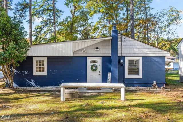 an aerial view of a houses with ocean view