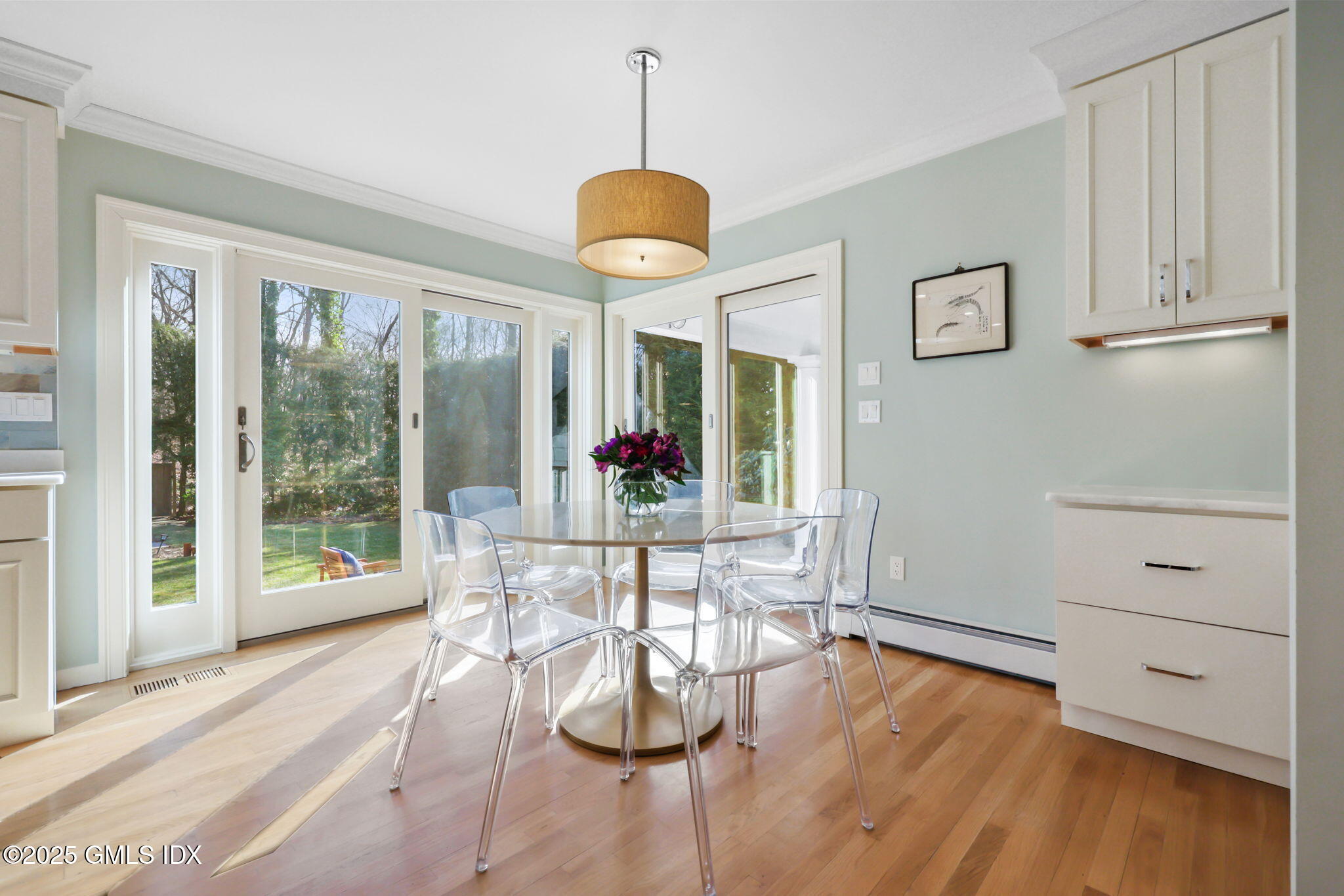 35 Indian Field Road Greenwich, CT 06830 - Photo 11 of 38 a view of a dining room with furniture window and wooden floor