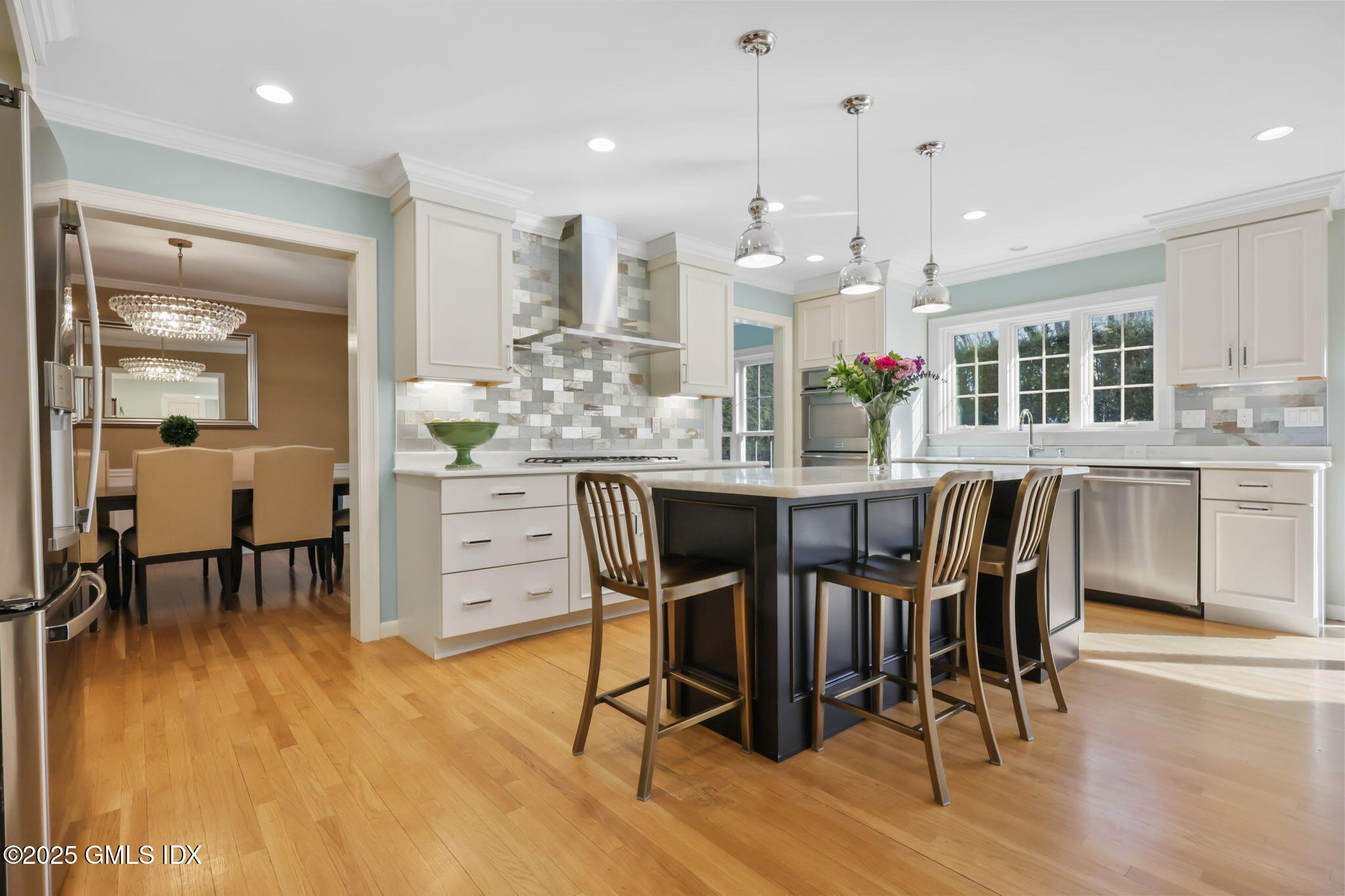 35 Indian Field Road Greenwich, CT 06830 - Photo 12 of 38 a dining area with furniture and wooden floor