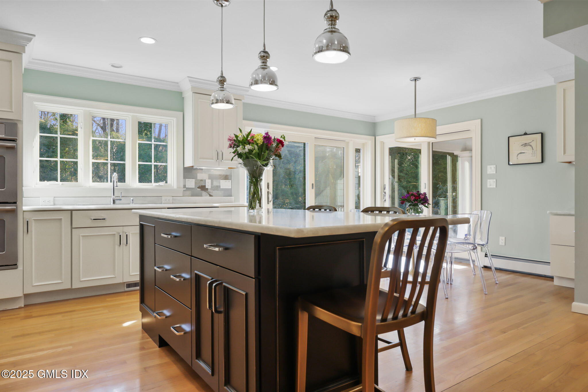 35 Indian Field Road Greenwich, CT 06830 - Photo 13 of 38 a kitchen with granite countertop a sink cabinets and wooden floor