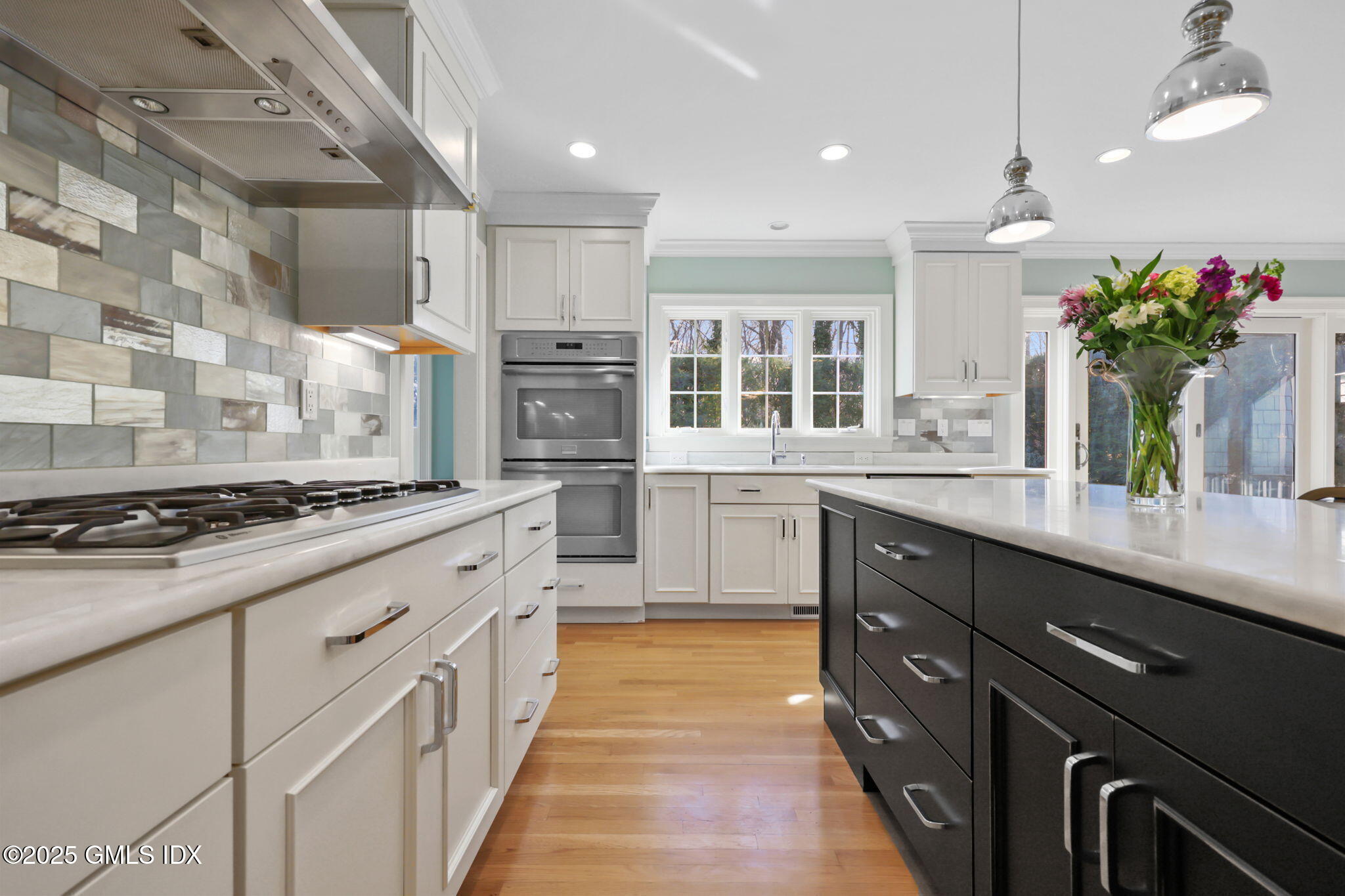 35 Indian Field Road Greenwich, CT 06830 - Photo 14 of 38 a kitchen with stainless steel appliances kitchen island granite countertop a stove a sink dishwasher and a refrigerator