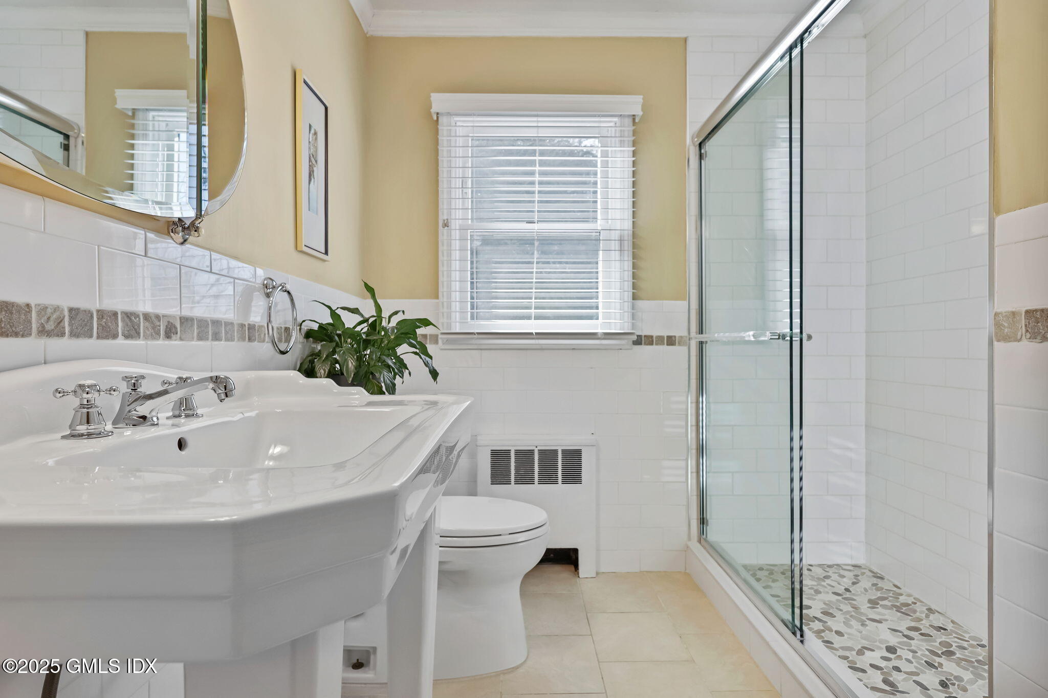 35 Indian Field Road Greenwich, CT 06830 - Photo 17 of 38 a bathroom with a sink a toilet and shower