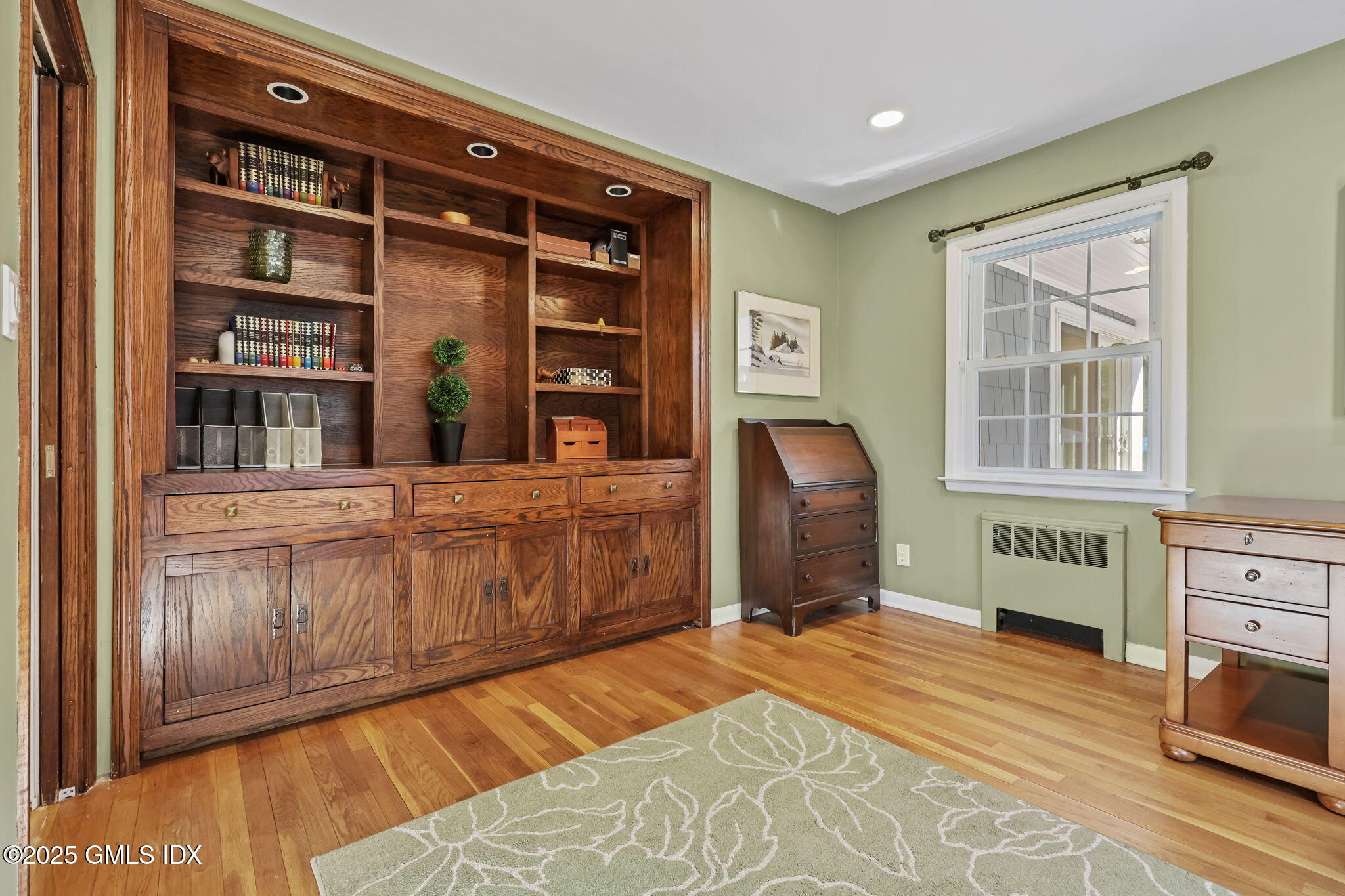 35 Indian Field Road Greenwich, CT 06830 - Photo 19 of 38 a bedroom with a bed and a cabinets
