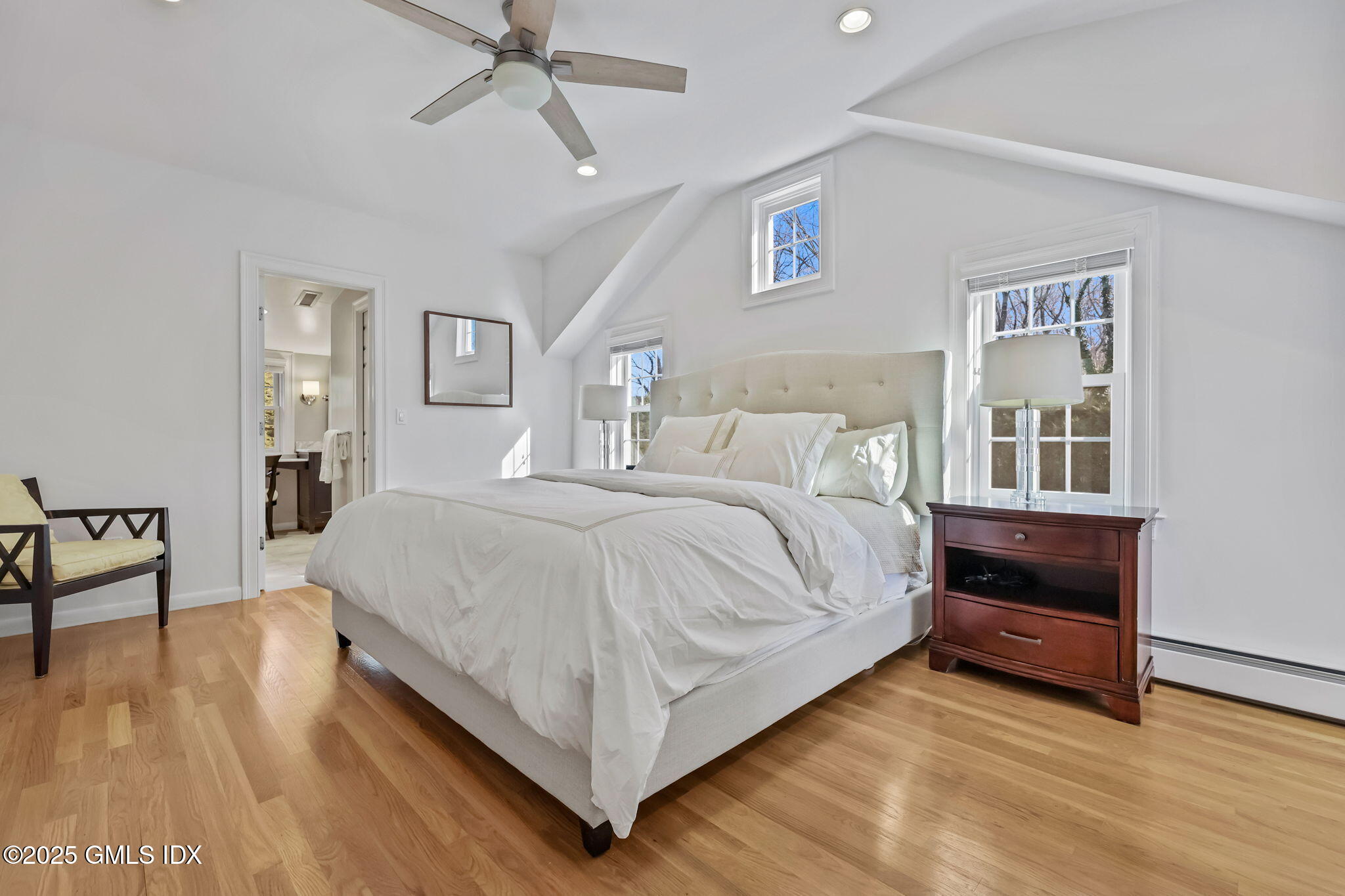 35 Indian Field Road Greenwich, CT 06830 - Photo 20 of 38 a bedroom with a bed and a night stand