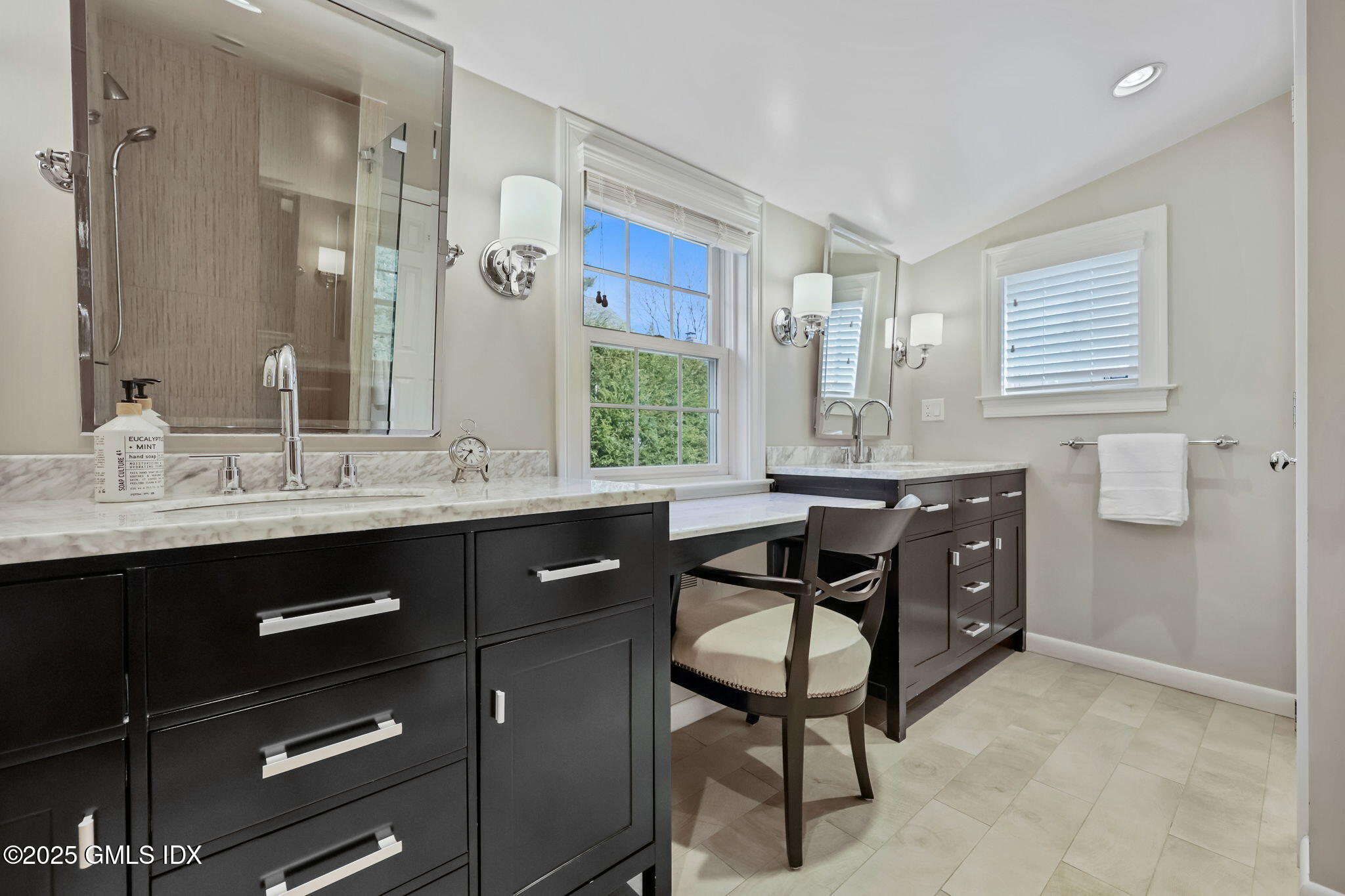 35 Indian Field Road Greenwich, CT 06830 - Photo 24 of 38 a bathroom with a sink vanity and a mirror