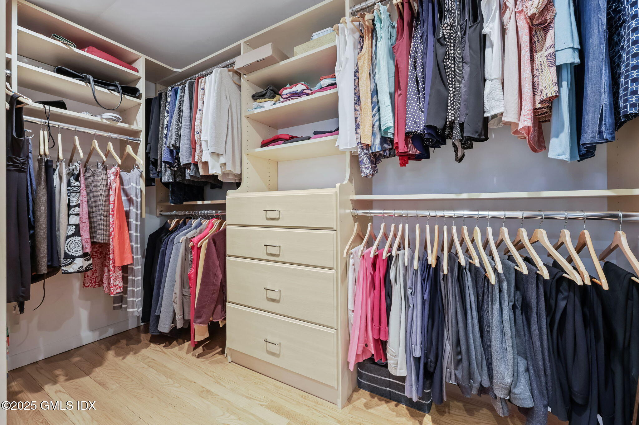 35 Indian Field Road Greenwich, CT 06830 - Photo 25 of 38 a view of walk in closet with clothes