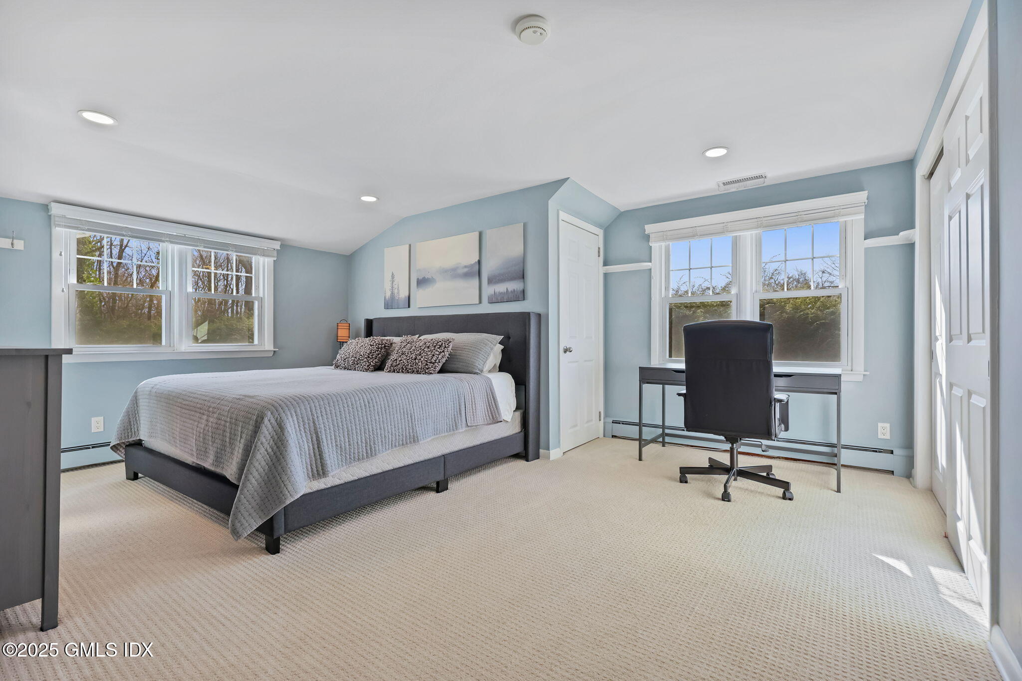 35 Indian Field Road Greenwich, CT 06830 - Photo 27 of 38 a bedroom with a bed chair and window