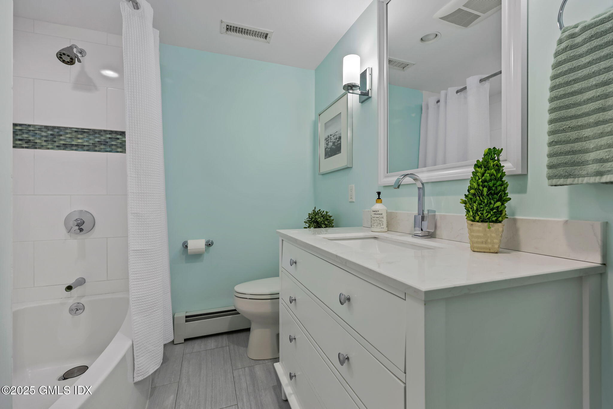 35 Indian Field Road Greenwich, CT 06830 - Photo 30 of 38 a bathroom with a sink toilet double vanity and tub