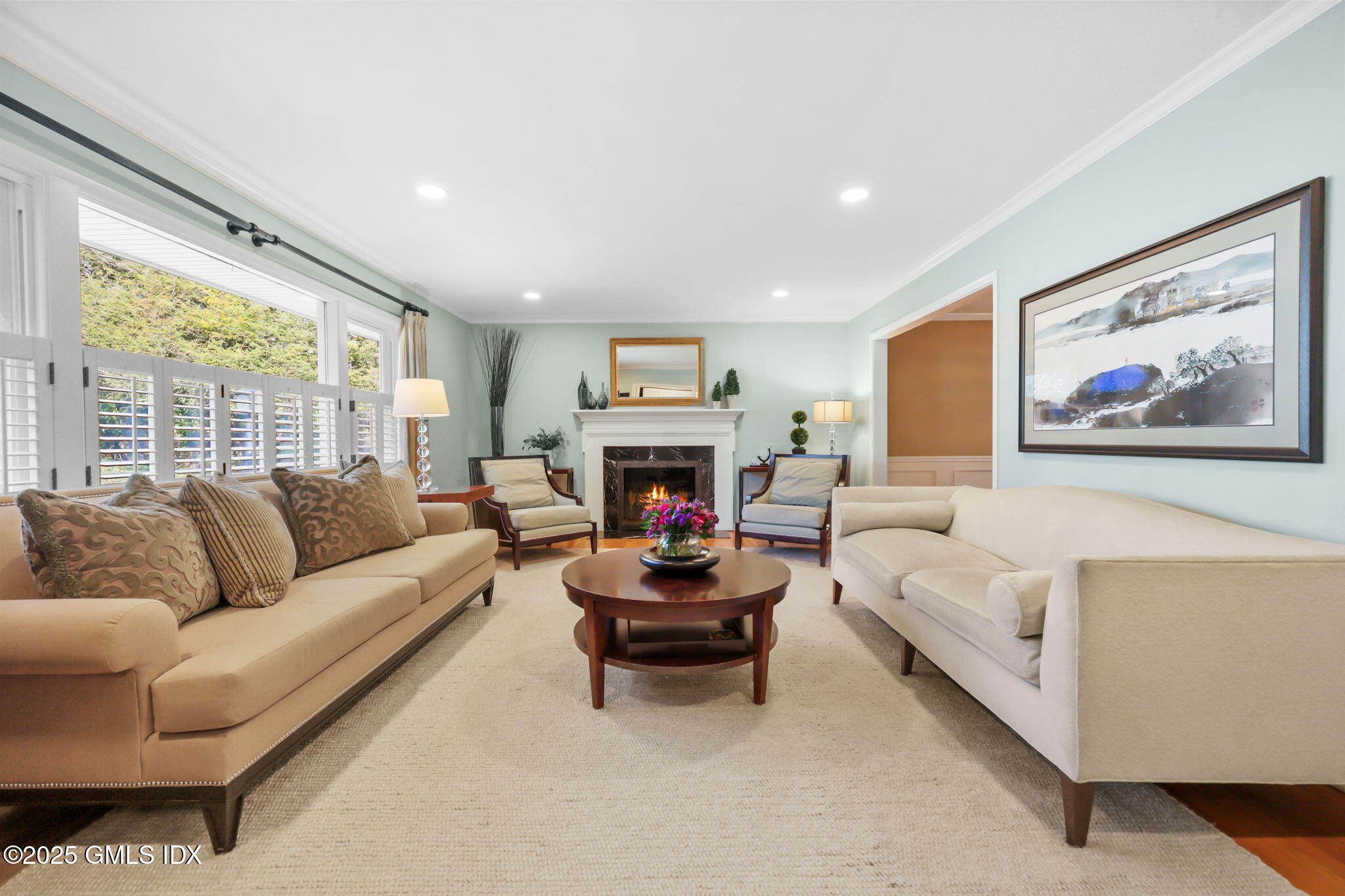 35 Indian Field Road Greenwich, CT 06830 - Photo 3 of 38 a living room with furniture a large window and a fireplace