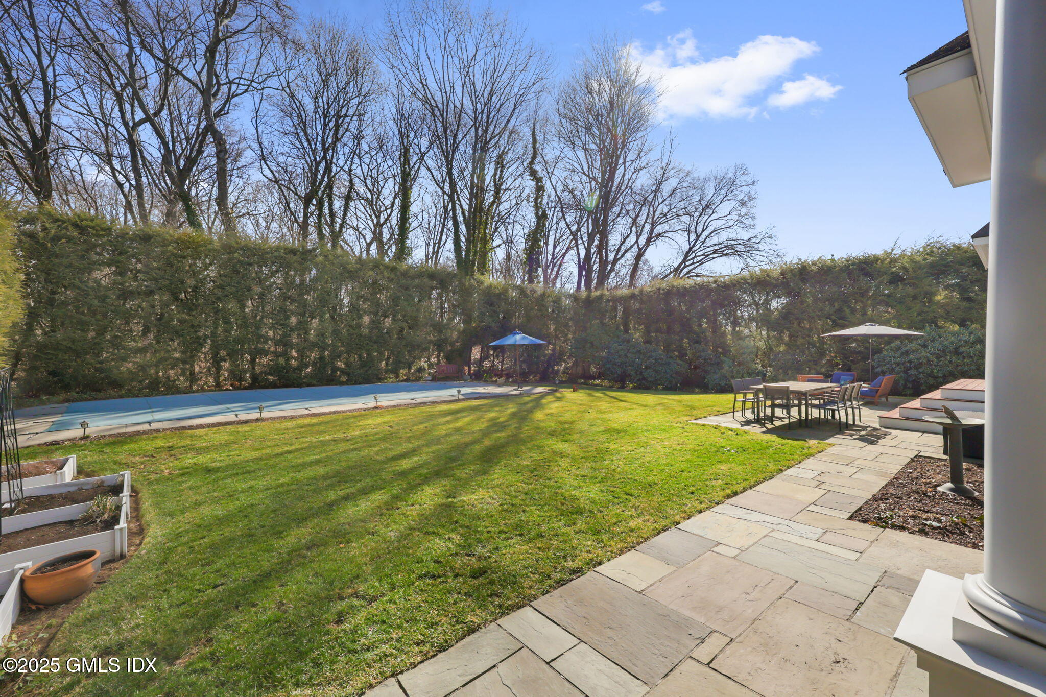 35 Indian Field Road Greenwich, CT 06830 - Photo 31 of 38 a view of a backyard with a garden