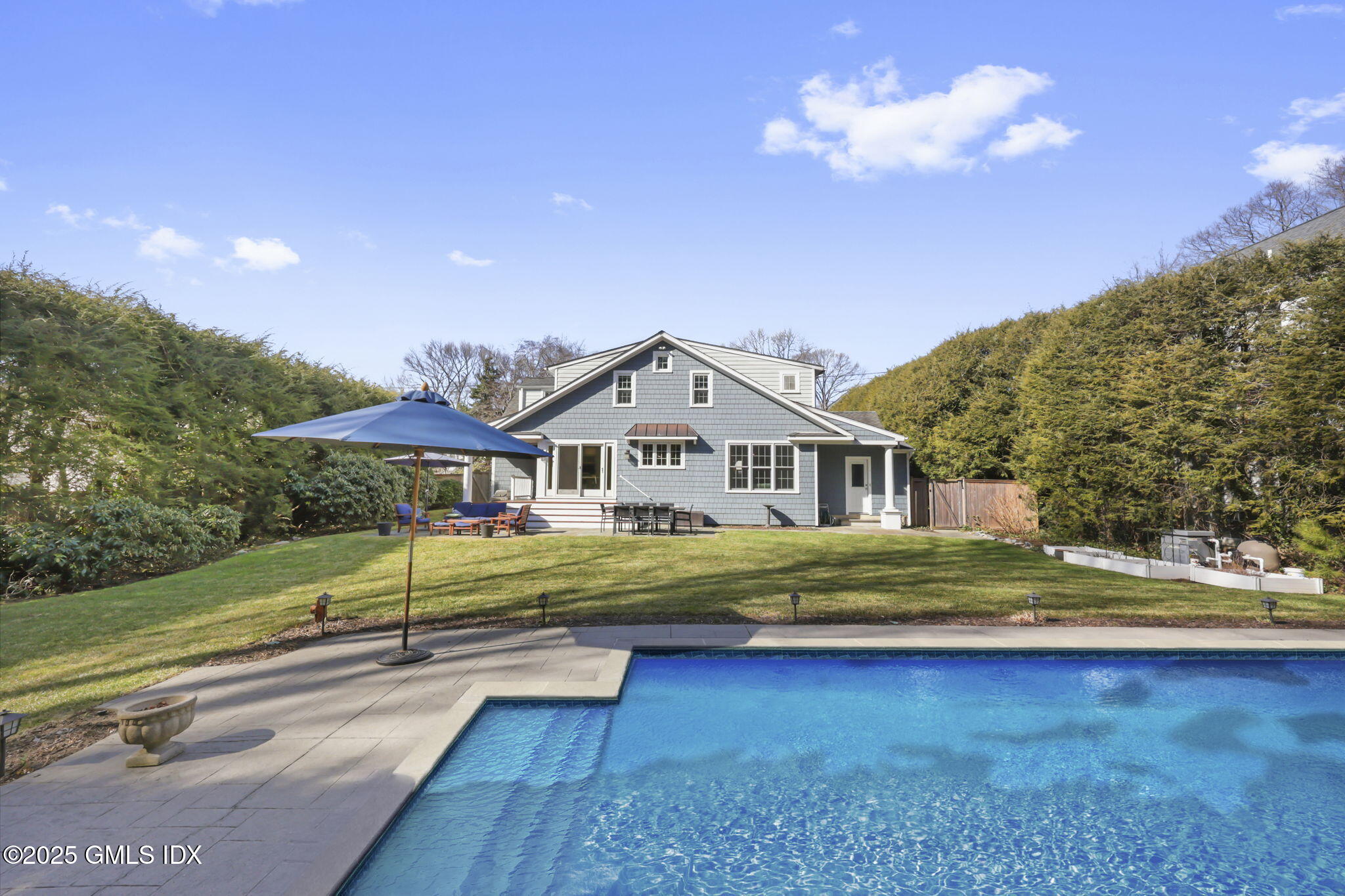 35 Indian Field Road Greenwich, CT 06830 - Photo 32 of 38 a front view of a house with a yard