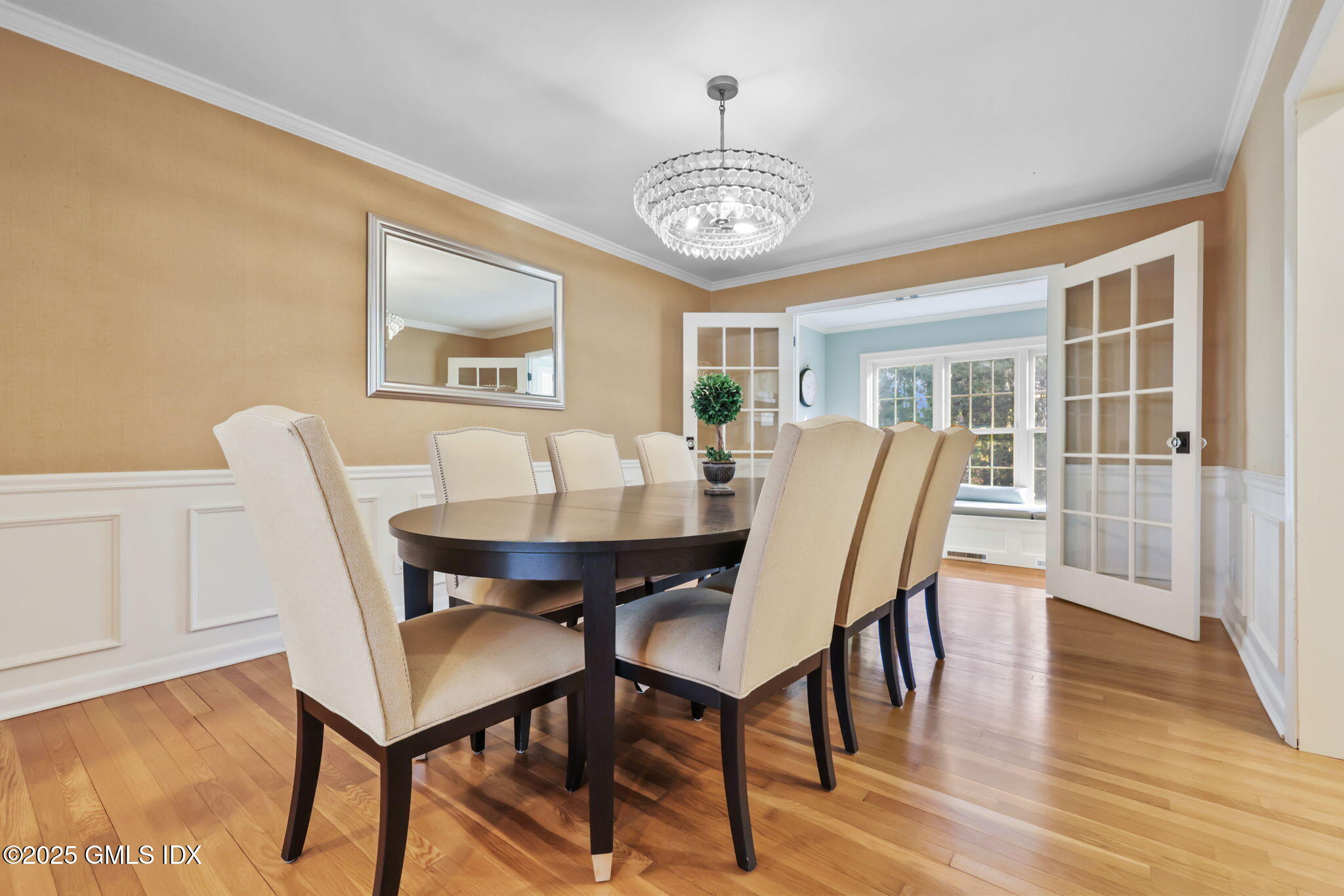 35 Indian Field Road Greenwich, CT 06830 - Photo 5 of 38 a view of a dining room with furniture wooden floor and chandelier