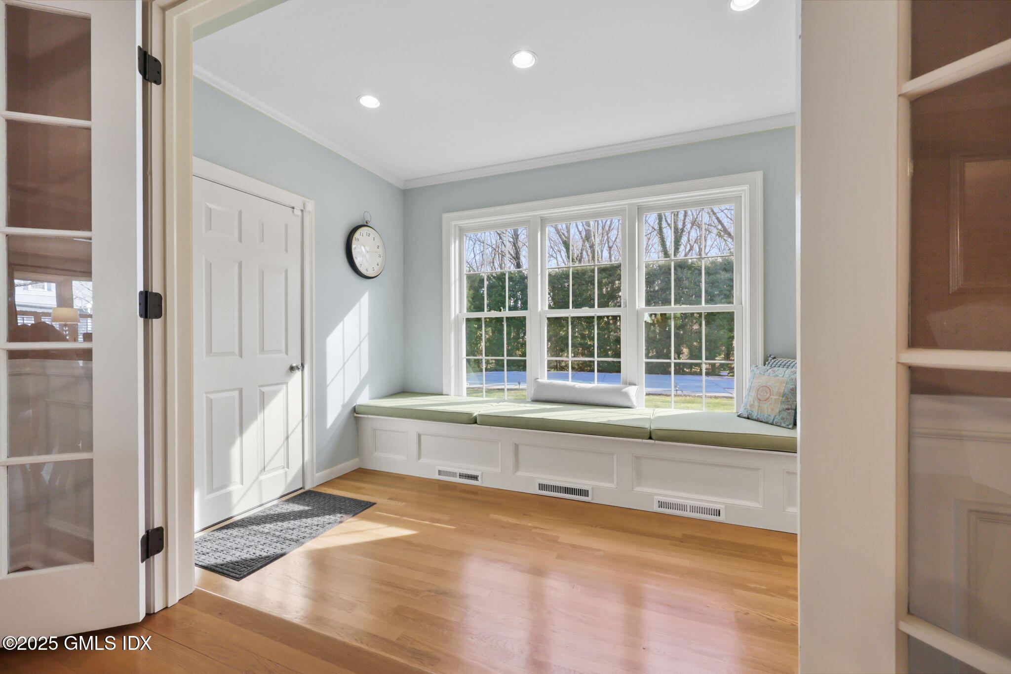 35 Indian Field Road Greenwich, CT 06830 - Photo 7 of 38 a view of an empty room with a window and wooden floor