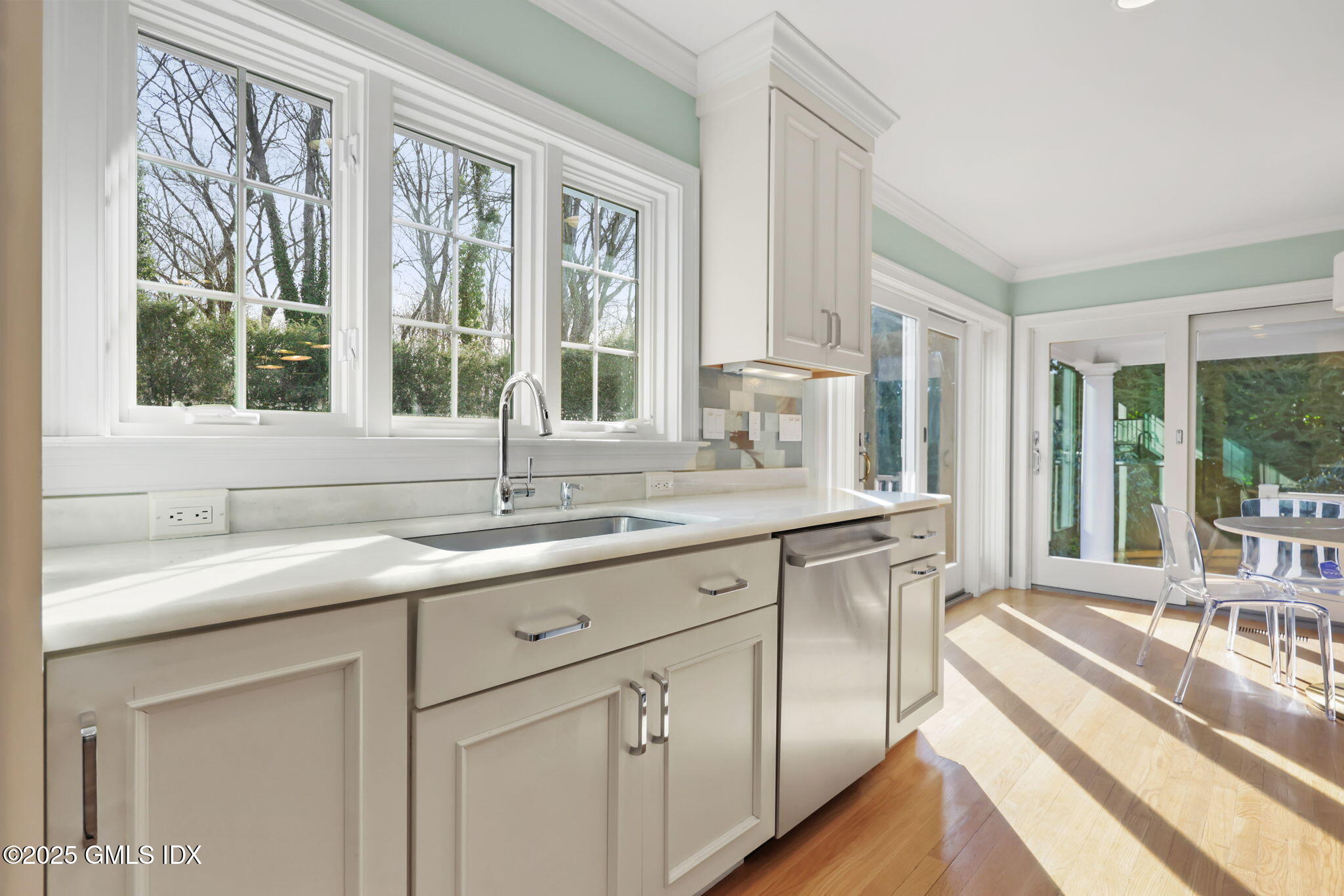 35 Indian Field Road Greenwich, CT 06830 - Photo 9 of 38 a kitchen with granite countertop a sink and a window