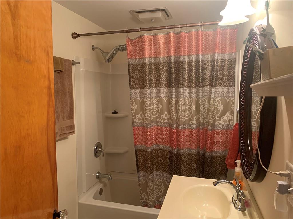 2404 Old Butler Road New Castle, PA 16101 - Photo 11 of 17 a bathroom with a sink and a shower