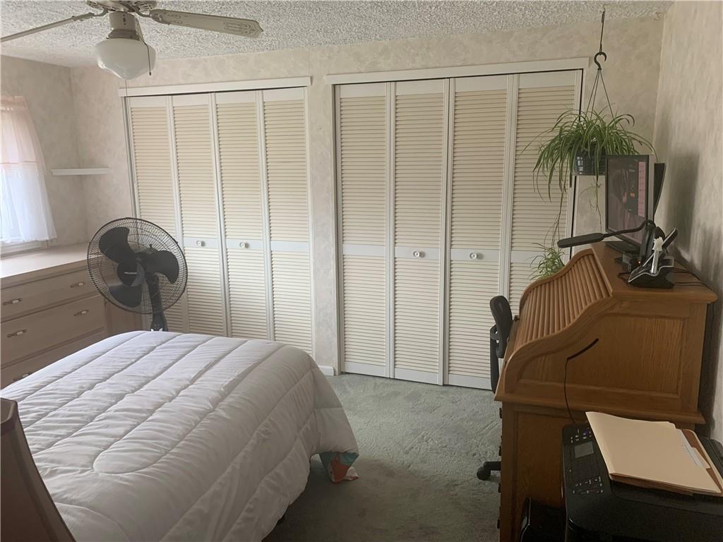 2404 Old Butler Road New Castle, PA 16101 - Photo 14 of 17 a bedroom with a bed and a potted plant