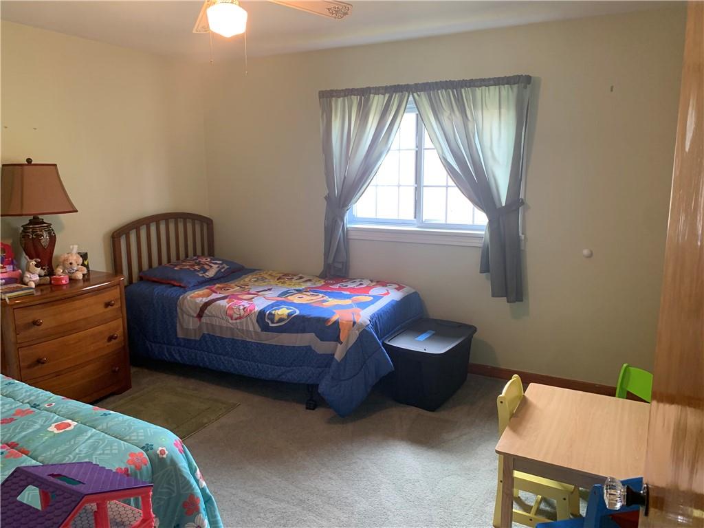 2404 Old Butler Road New Castle, PA 16101 - Photo 10 of 17 a bedroom with a bed and a window