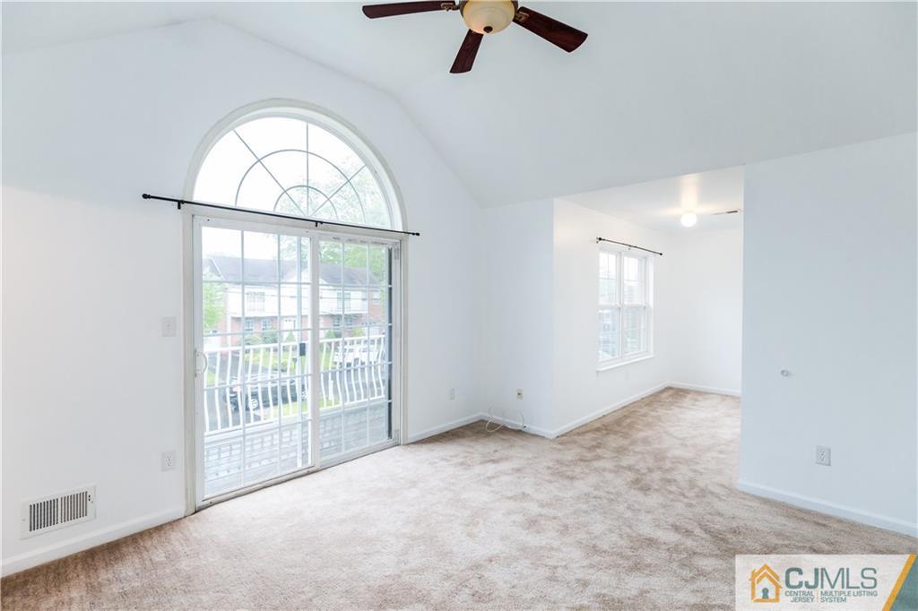 987 Cox Road North Brunswick, NJ 08902 - Photo 19 of 25 an empty room with windows and ceiling fan