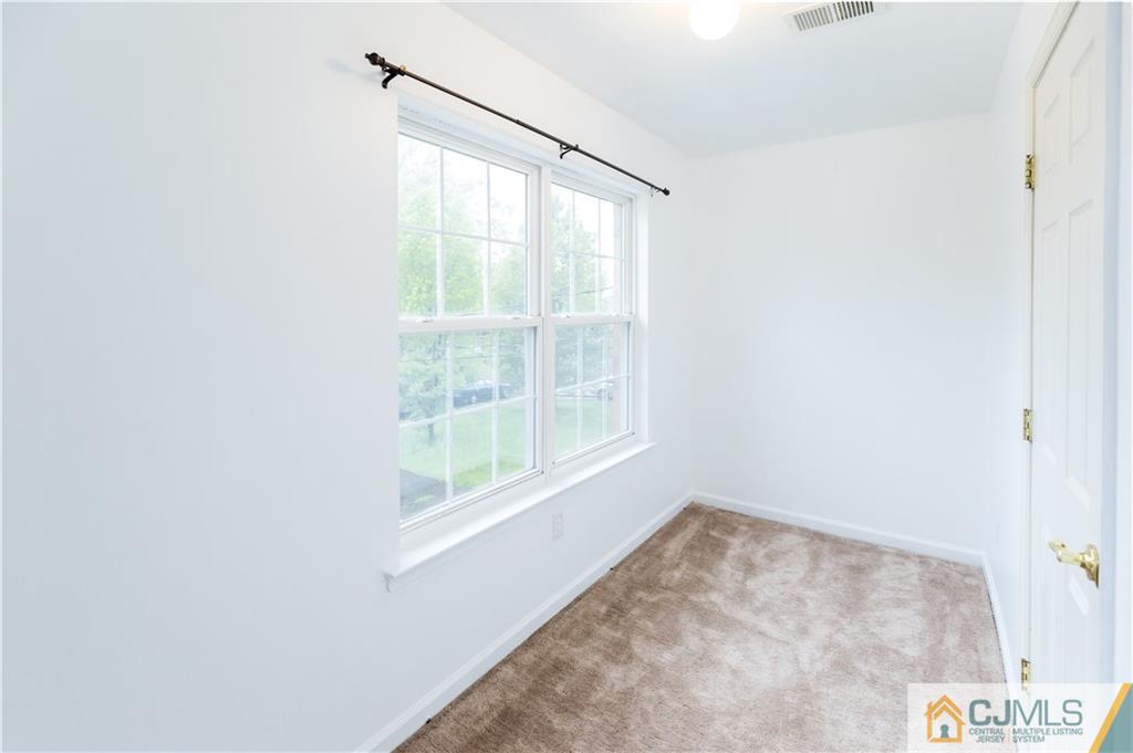 987 Cox Road North Brunswick, NJ 08902 - Photo 21 of 25 a view of an empty room with a window