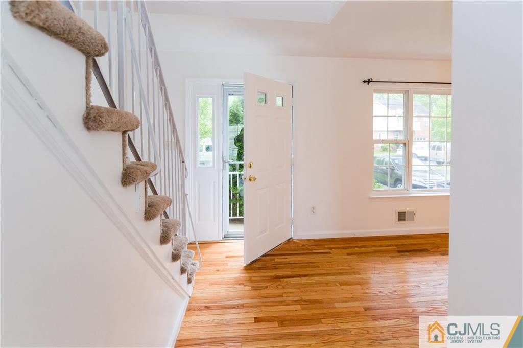 987 Cox Road North Brunswick, NJ 08902 - Photo 4 of 25 a view of an entryway with staircase