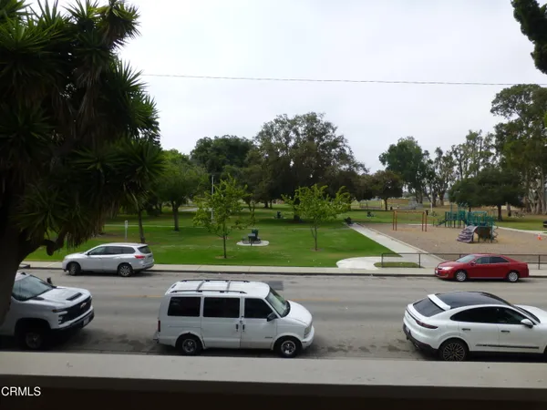 a view of a yard with cars