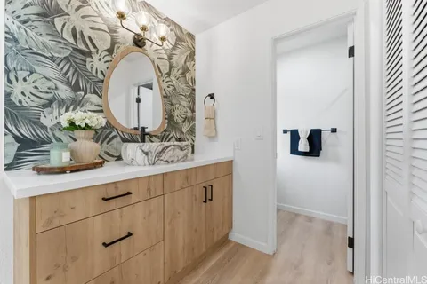 a bathroom with a sink and mirror