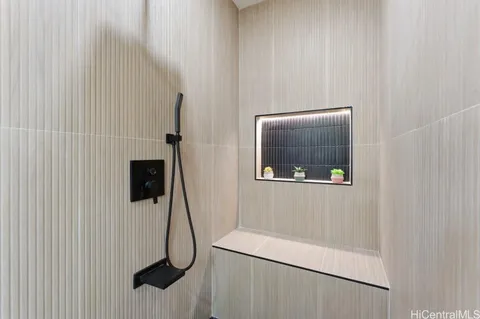 a room with a wooden floor and a wall painting