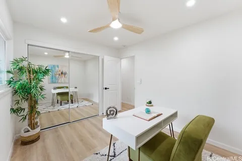 a workspace with furniture and window