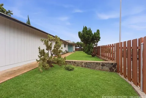 a view of a backyard with a garden