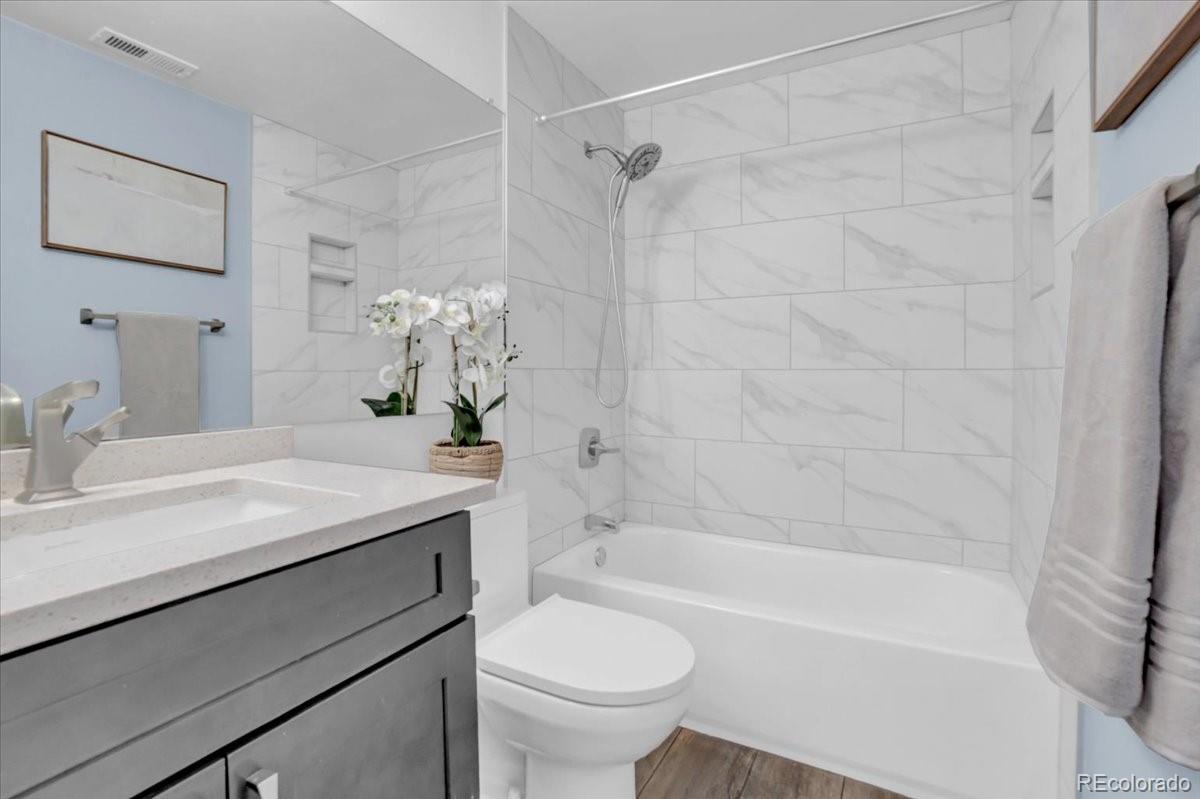 3066 West Prentice Avenue, Unit G Littleton, CO 80123 - Photo 11 of 18 a bathroom with a sink a toilet and a bathtub